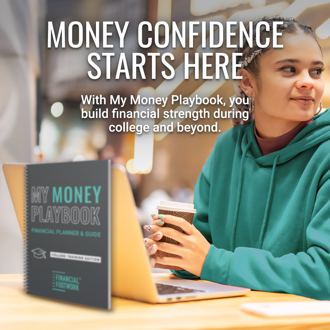 college student using a laptop with My Money Playbook physical financial planner on a desk